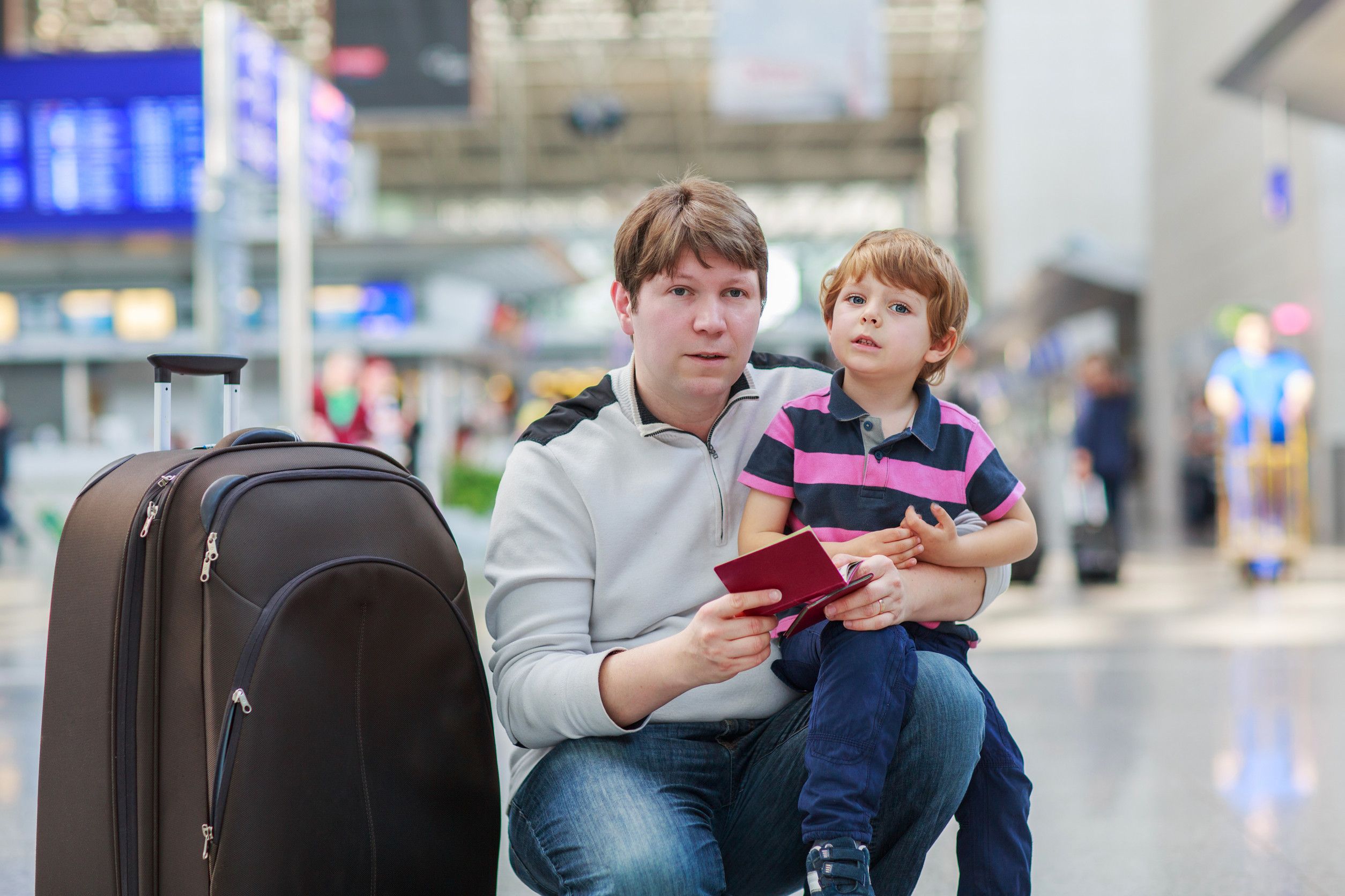 Happy Family Of Two Father And Little Son At The Airport Traveling Together Happy Family Of Two Father And Little Son At The Airport Traveling Together